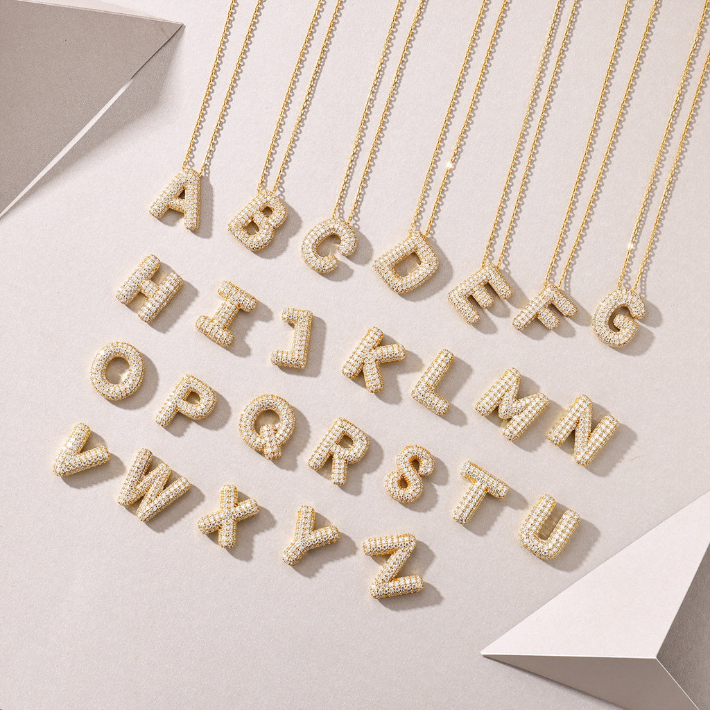 Golden Heir bubble letter W pendant necklace with S925 silver and gold electroplating, featuring moissanite accents.