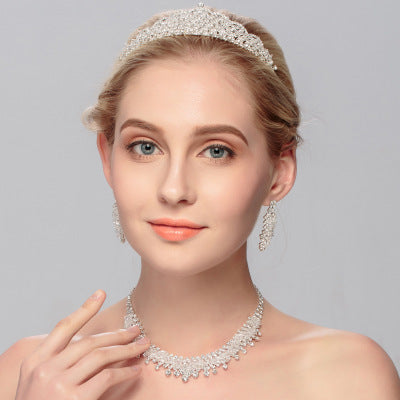 Golden Heir wedding jewelry set featuring elegant earrings and necklace with intricate designs, perfect for special occasions.