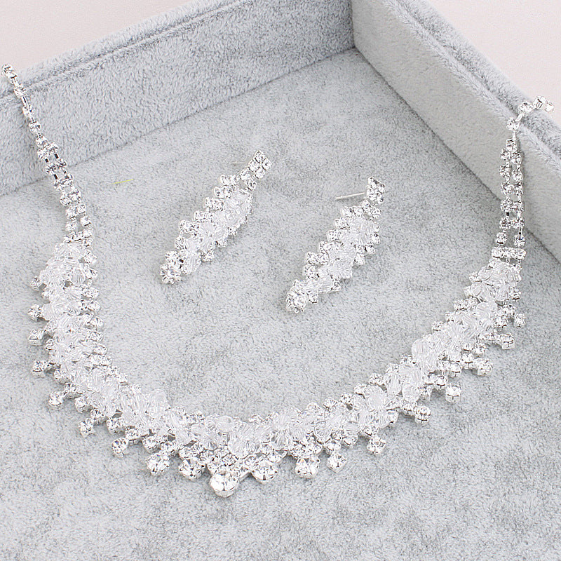 Golden Heir wedding jewelry set featuring elegant earrings and necklace with intricate designs for bridal accessories