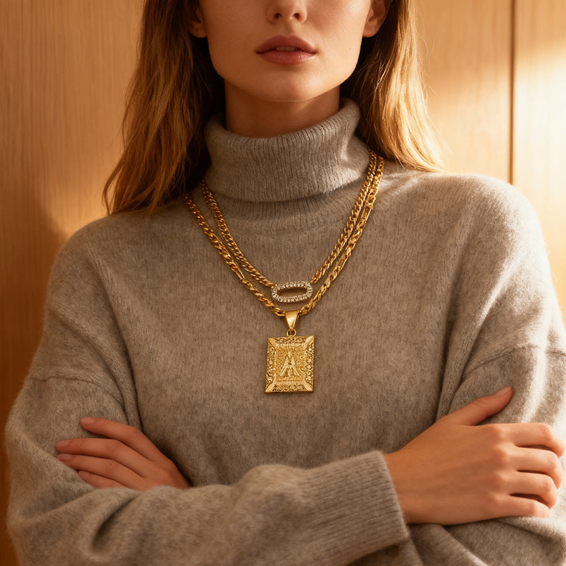Golden Heir double-layer gold necklace with 26-letter pendant and zircon circle accents, showcasing a stylish jewelry design.