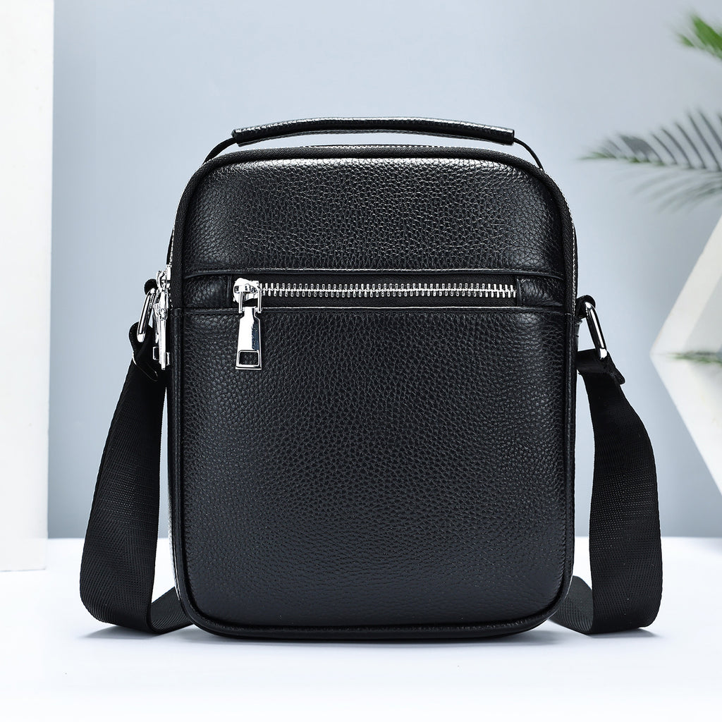 Men's first layer cowhide crossbody bag by Golden Heir, showing the black leather bag with adjustable strap and front pocket.