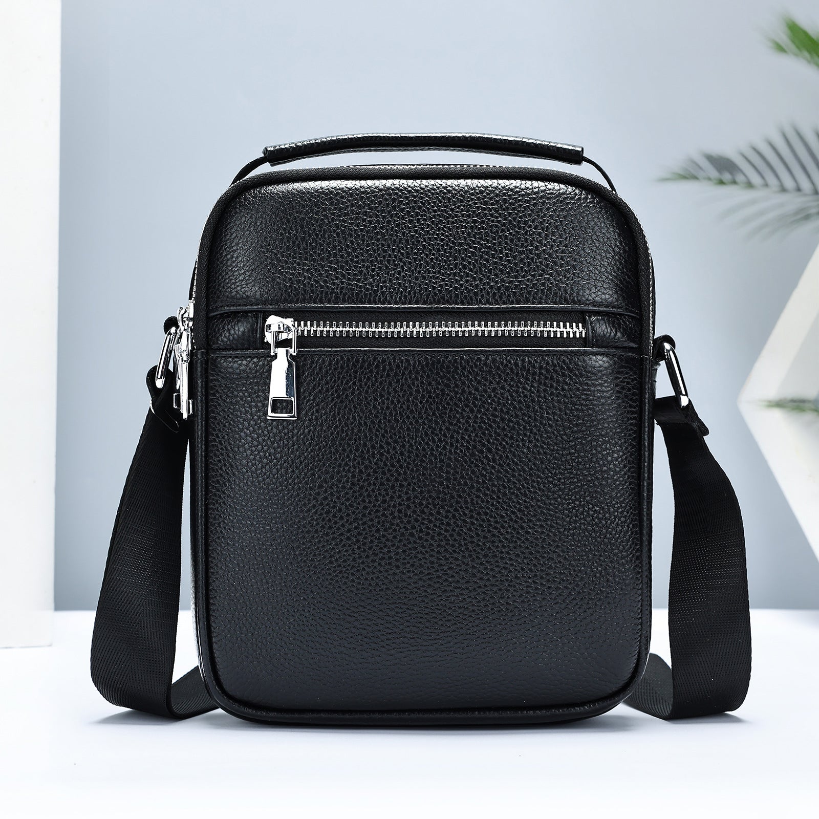 Golden Heir men's cowhide crossbody bag with adjustable strap, front pocket, and durable leather material.