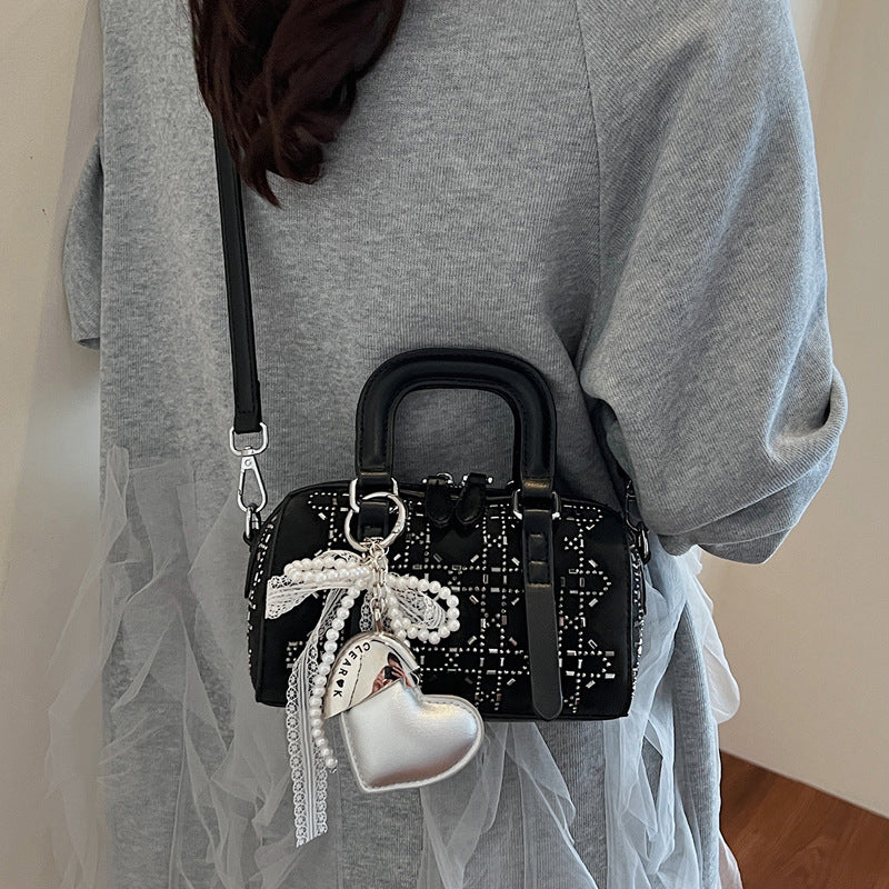 Golden Heir Korean-style minimalist cylindrical tote bag with versatile design and clean lines, made from durable materials.