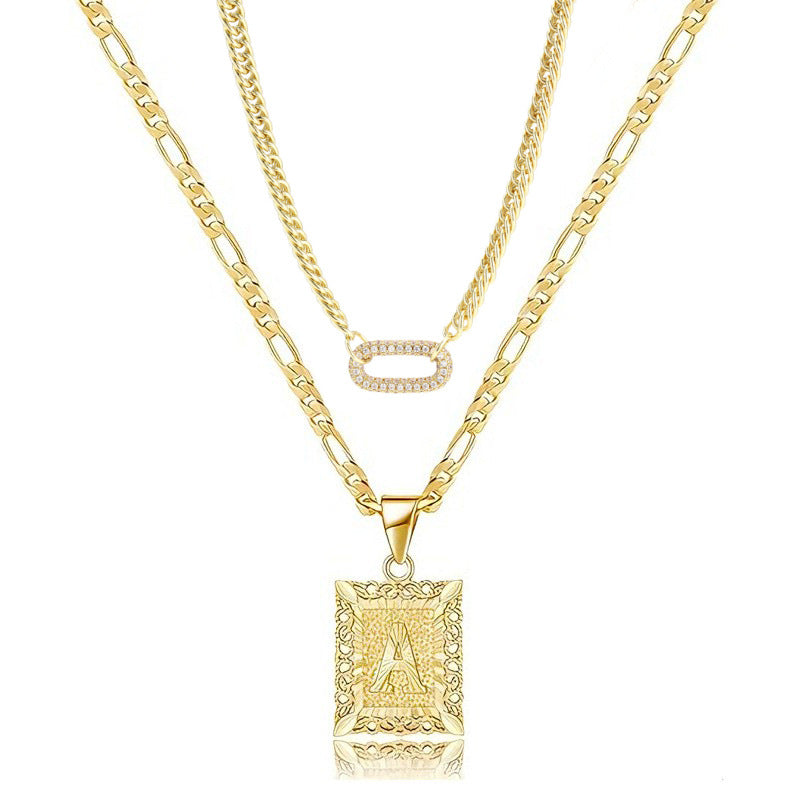 Golden Heir double-layer gold necklace with 26-letter charms and zircon circle accents, showcasing a stylish jewelry piece.