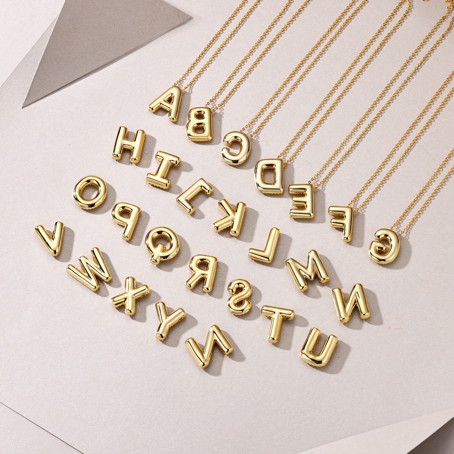 Golden Heir bubble letter W pendant necklace featuring S925 silver with gold electroplating and moissanite accents.