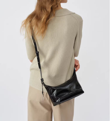 Black genuine full-grain leather women's crossbody bag from Golden Heir, featuring a sleek, structured design and adjustable strap.