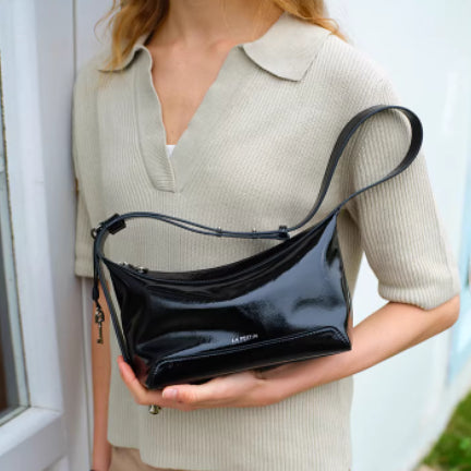Black full-grain leather women's crossbody bag by Golden Heir, featuring a sleek genuine leather design and adjustable strap.